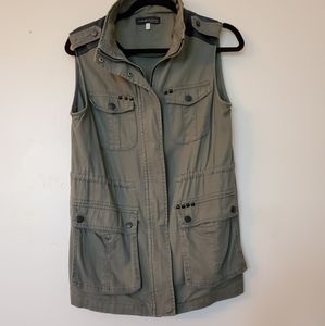 Army green vest with black studded details
